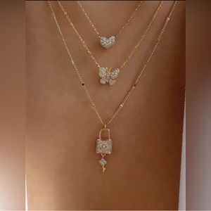 Gold Layered Necklace with Heart, Butterfly & Lock Pendants
